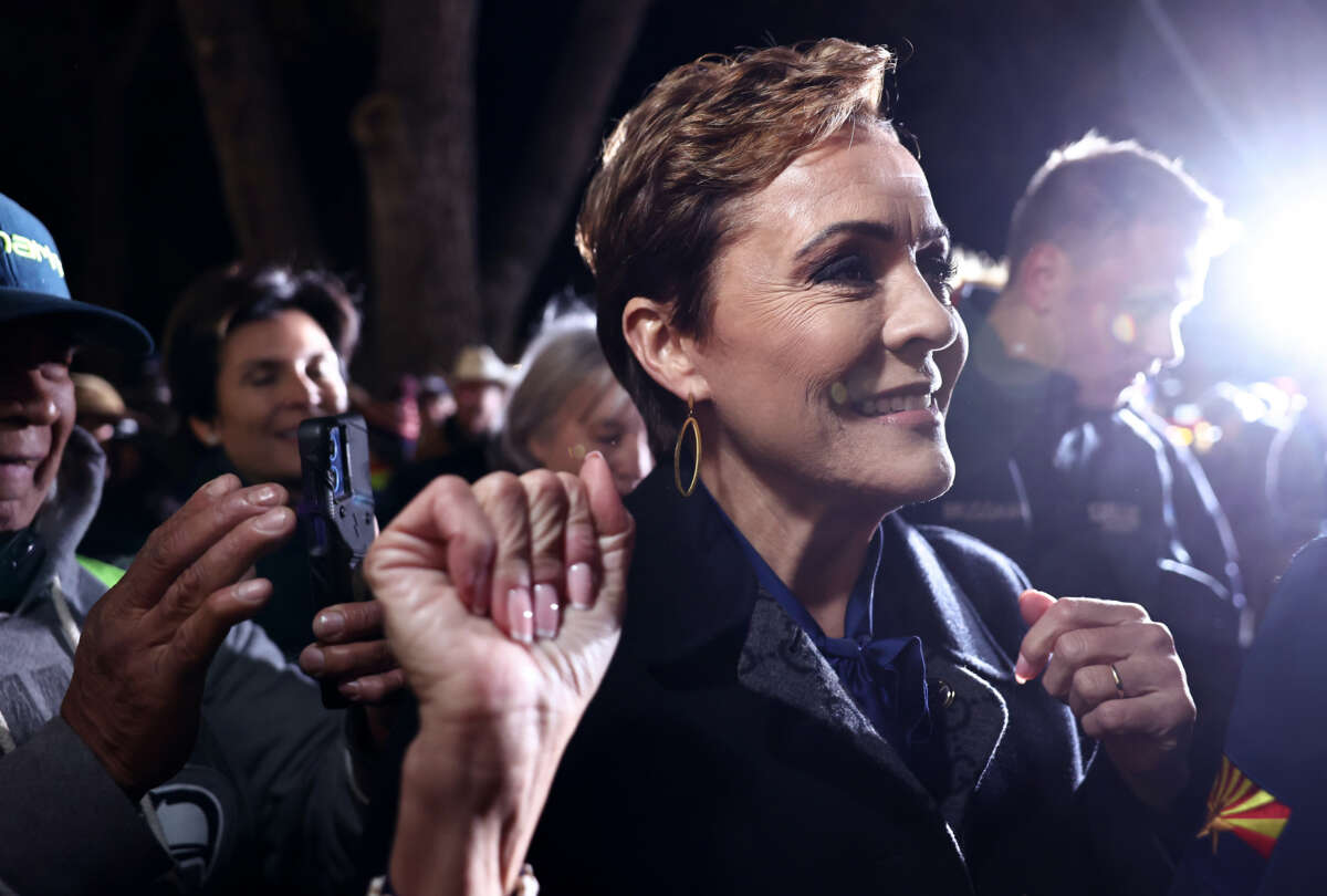 Arizona Republican Senate candidate Kari Lake greets supporters at her Election Eve Rally outside the Yavapai County Courthouse on November 4, 2024, in Prescott, Arizona.