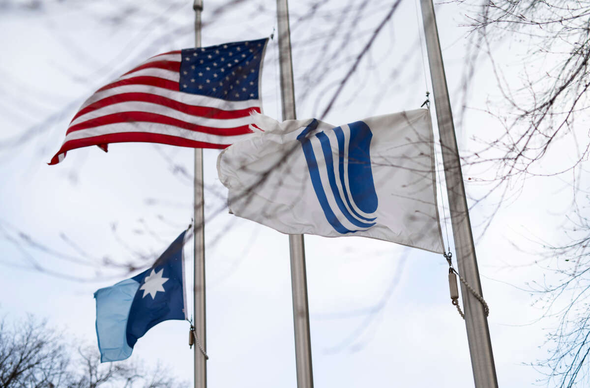 Flags fly at half mast outside the UnitedHealth Group corporate headquarters on December 4, 2024, in Minnetonka City, Minnesota.