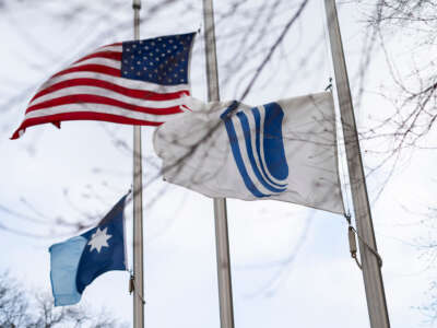 Flags fly at half mast outside the UnitedHealth Group corporate headquarters on December 4, 2024, in Minnetonka City, Minnesota.