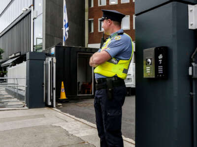 A guard is seen on duty at the entrance to the Israeli embassy in Dublin on May 22, 2024.