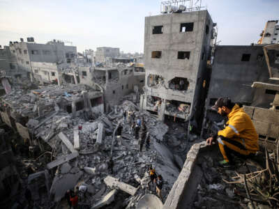 Palestinians inspect the damage after an Israeli strike on the Nuseirat refugee camp in the central Gaza Strip on December 7, 2024.