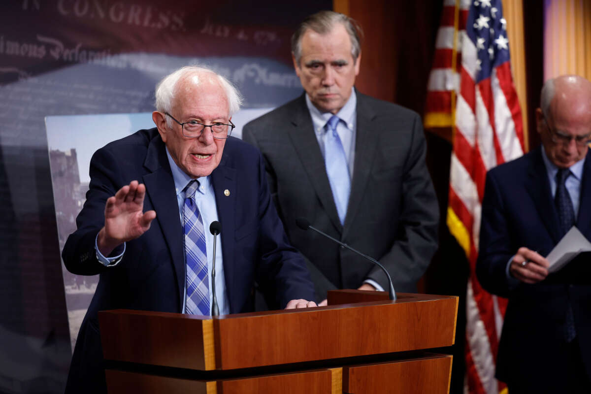 Sen. Bernie Sanders, joined by fellow senators Sen. Jeff Merkley (center) and Sen. Peter Welch, speaks at a news conference on restricting arms sales to Israel at the U.S. Capitol on November 19, 2024, in Washington, D.C.