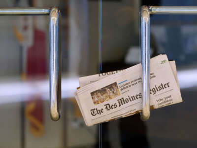 A copy of The Des Moines Register is tucked into an office door as Winter storm Gerri arrives in Iowa four days before the caucuses on January 12, 2024, in Des Moines, Iowa.