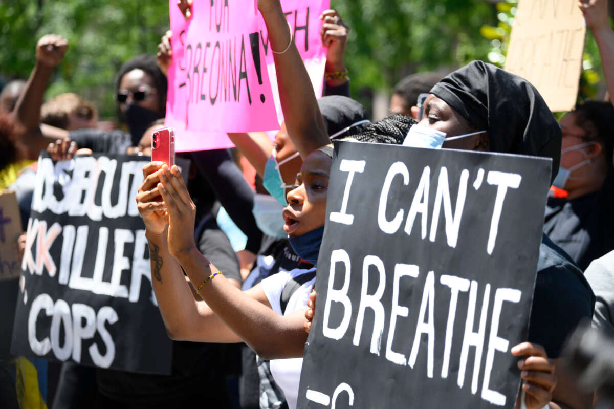 Philadelphians participate in a vigil for George Floyd as thousands around the nation protest police brutality during similar events, outside City Hall in Philadelphia, Pennsylvania, on May 30, 2020.