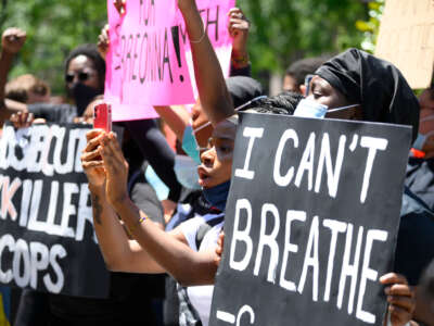 Philadelphians participate in a vigil for George Floyd as thousands around the nation protest police brutality during similar events, outside City Hall in Philadelphia, Pennsylvania, on May 30, 2020.