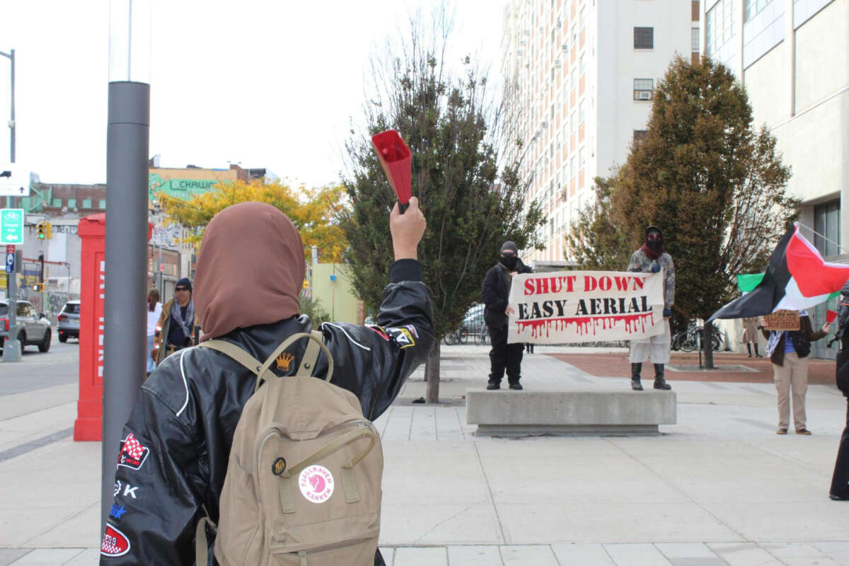 Activists with Demilitarize Brooklyn Navy Yard hold a demonstration against Easy Aerial and Crye Precision outside the Brooklyn Navy Yard in New York on November 4, 2024.