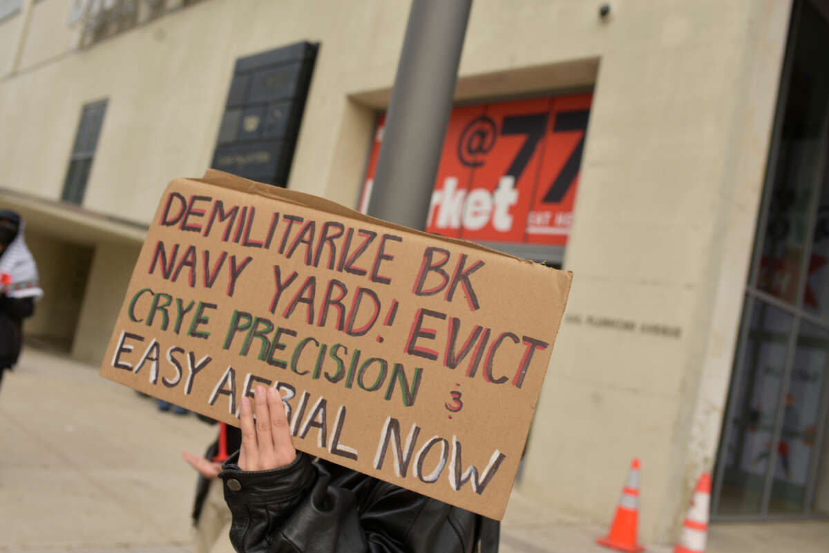 Activists with Demilitarize Brooklyn Navy Yard hold a demonstration against Easy Aerial and Crye Precision outside the Brooklyn Navy Yard in New York on November 20.