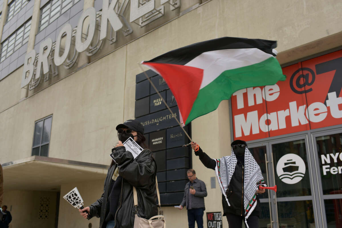 Activists with Demilitarize Brooklyn Navy Yard hold a demonstration against Easy Aerial and Crye Precision outside the Brooklyn Navy Yard in New York on November 20.