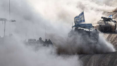 Israeli tanks move along the border near Rafah, Gaza, on May 29, 2024.