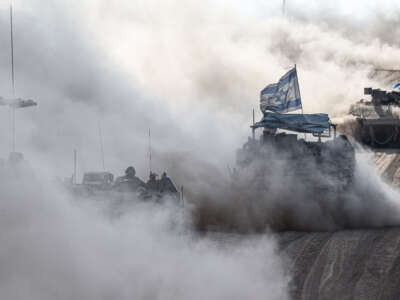 Israeli tanks move along the border near Rafah, Gaza, on May 29, 2024.