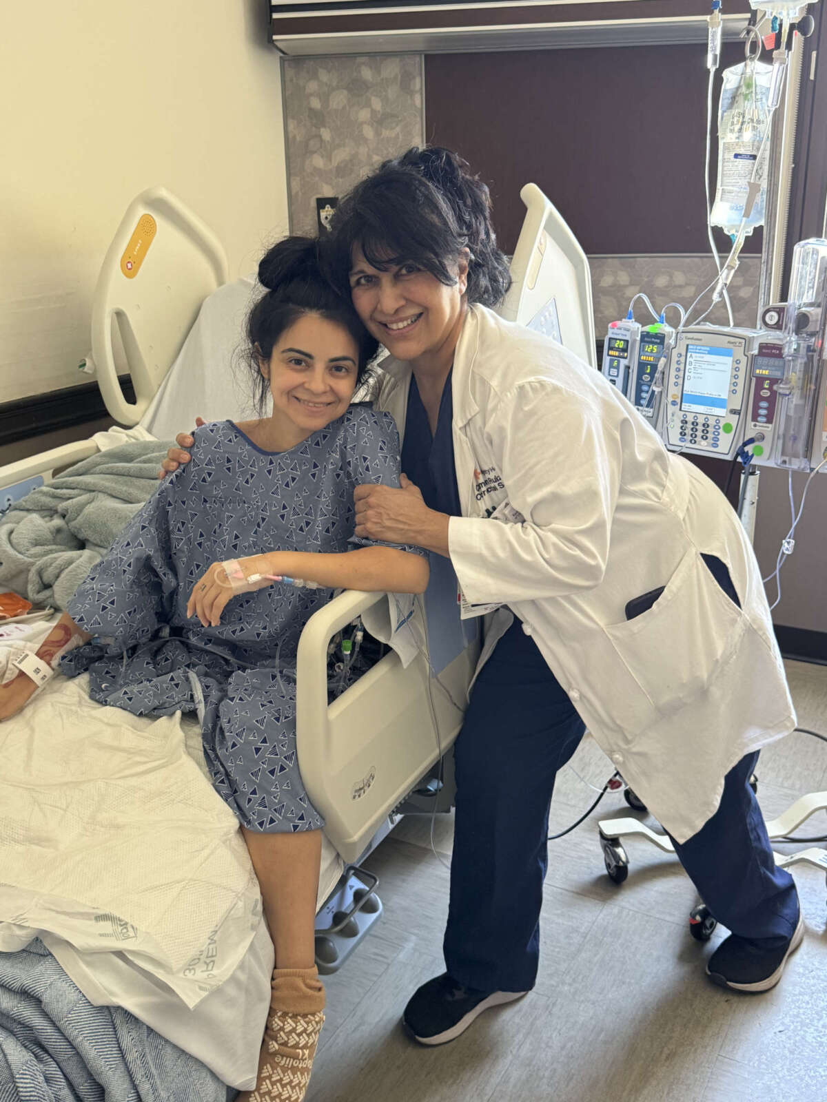 Michelle shares a heartfelt embrace with her surgeon, Dr. Carmen Ruiz, after a successful tumor removal surgery in August, 2024.