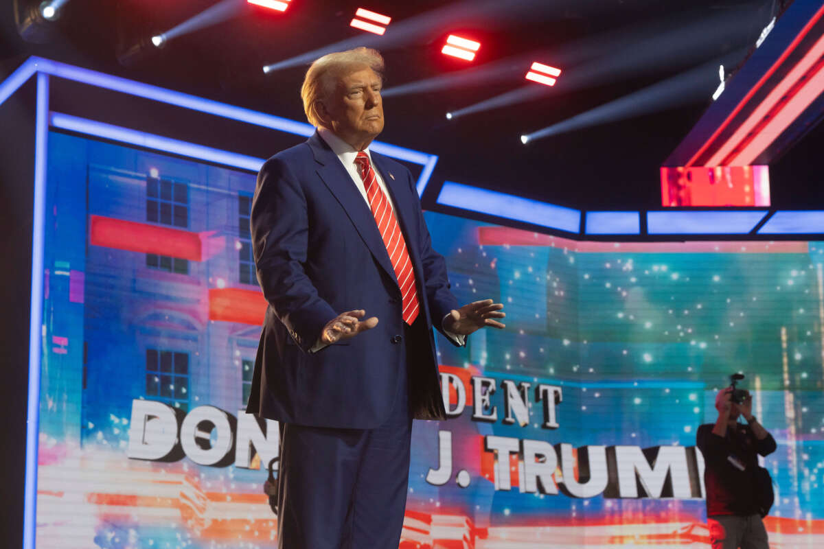 President-elect Donald Trump dances during Turning Point USA's AmericaFest at the Phoenix Convention Center on December 22, 2024, in Phoenix, Arizona.