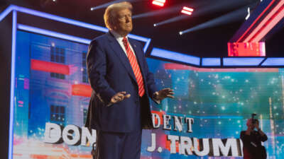 President-elect Donald Trump dances during Turning Point USA's AmericaFest at the Phoenix Convention Center on December 22, 2024, in Phoenix, Arizona.