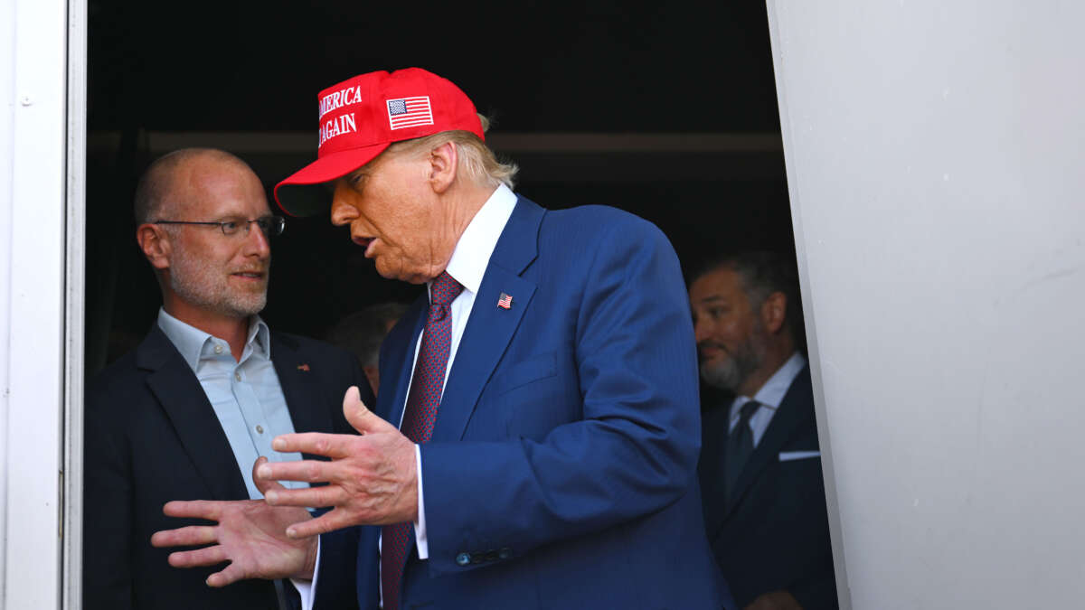 President-elect Donald Trump speaks to Brendan Carr, his intended pick for chairman of the Federal Communications Commission, as he attends a viewing of the launch of the sixth test flight of the SpaceX Starship rocket on November 19, 2024, in Brownsville, Texas.