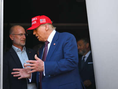 President-elect Donald Trump speaks to Brendan Carr, his intended pick for chairman of the Federal Communications Commission, as he attends a viewing of the launch of the sixth test flight of the SpaceX Starship rocket on November 19, 2024, in Brownsville, Texas.