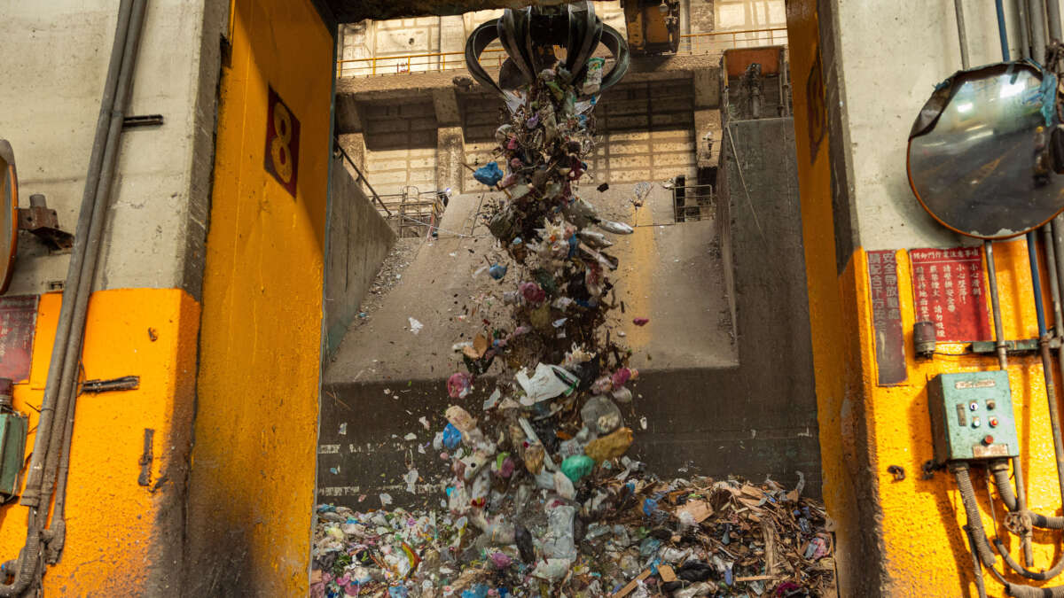 A refuse crane operates in a waste bunker at Tainan Yongkang garbage incineration plant on December 9, 2024, in Tainan, Taiwan.