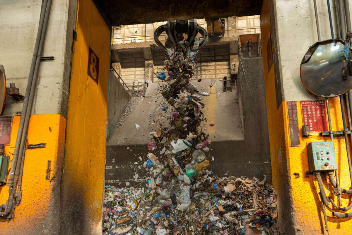 A refuse crane operates in a waste bunker at Tainan Yongkang garbage incineration plant on December 9, 2024, in Tainan, Taiwan.