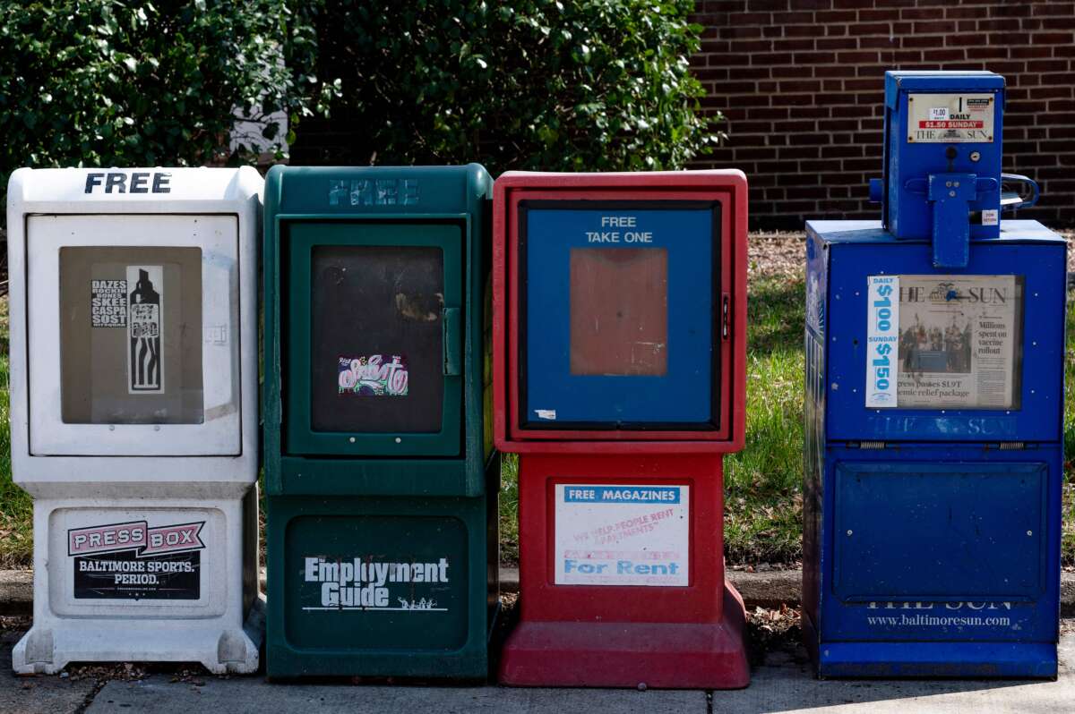 A Baltimore Sun newspaper bin stands with others in Baltimore, Maryland, on March 11, 2021.