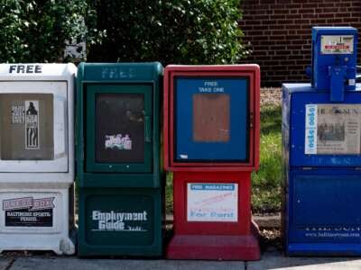 A Baltimore Sun newspaper bin stands with others in Baltimore, Maryland, on March 11, 2021.