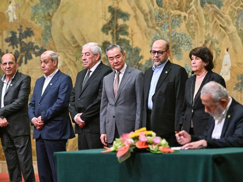 China's Foreign Minister Wang Yi looks on during the signing of the "Beijing declaration," an agreement by 14 Palestinian factions to set up an "interim national reconciliation government" to govern Gaza after the war, at the Diaoyutai State Guesthouse in Beijing, China, on July 23, 2024.