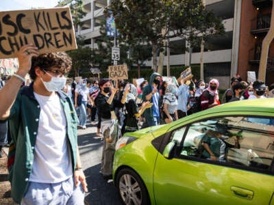 USC students walk out of class and march around their campus in support of Palestinians and the divest movement on October 7, 2024, in Los Angeles, California.