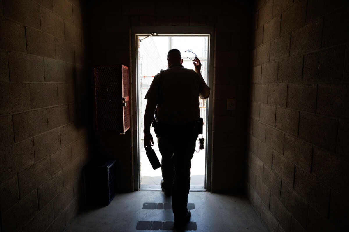 Lt. Johnathon Cuske leaves a corridor on death row and walks outside to what once was the caged area for death row inmates at the Central California Women's Facility on June 18, 2024, in Chowchilla, California.