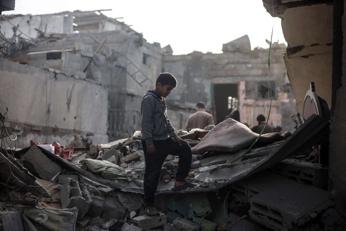 Palestinians inspect the damage after an Israeli strike on the Nuseirat refugee camp in the central Gaza Strip, on December 7, 2024.