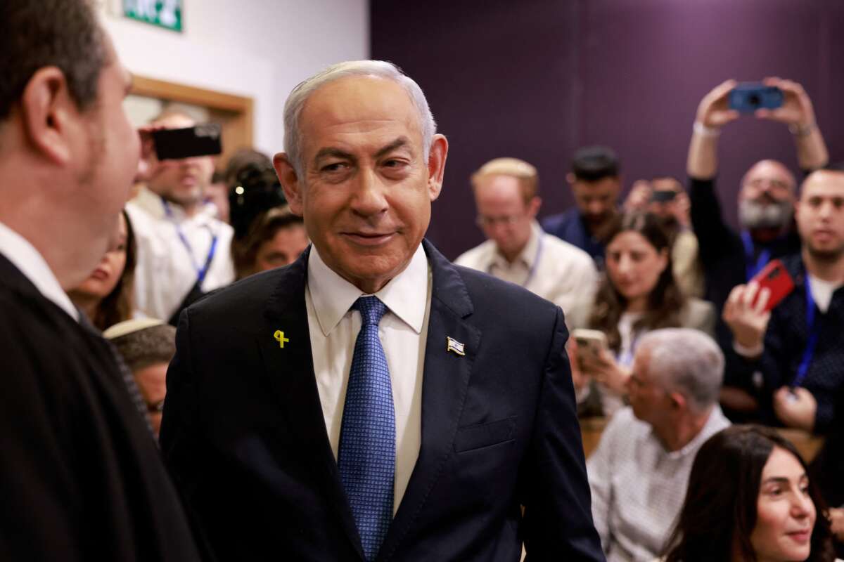 Israeli Prime Minister Benjamin Netanyahu arrives at the district court in Tel Aviv for his hearing on corruption charges on December 10, 2024.