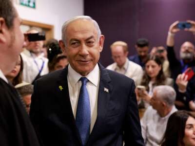 Israeli Prime Minister Benjamin Netanyahu arrives at the district court in Tel Aviv for his hearing on corruption charges on December 10, 2024.