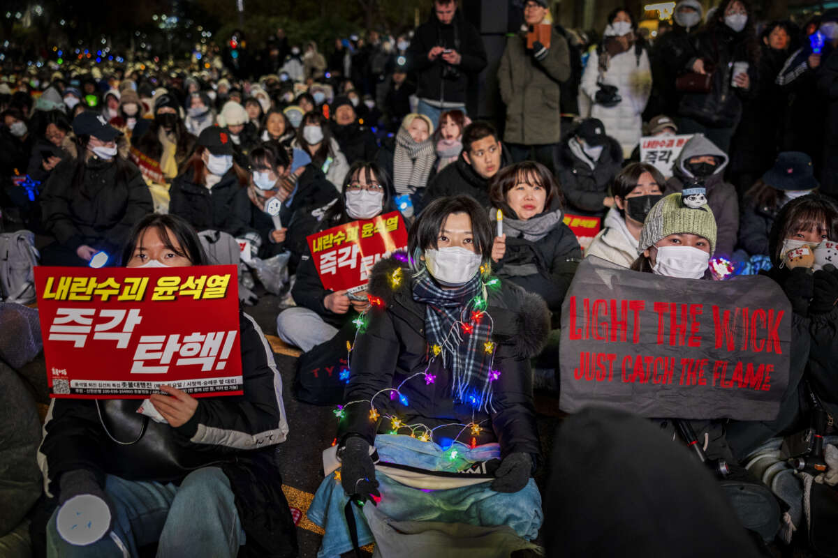 Protesters take part in a protest against the president outside the National Assembly on December 8, 2024, in Seoul, South Korea.