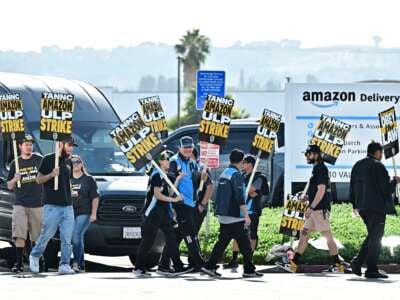 Amazon workers walk the picket line outside an Amazon facility in the City of Industry, California, on December 19, 2024.