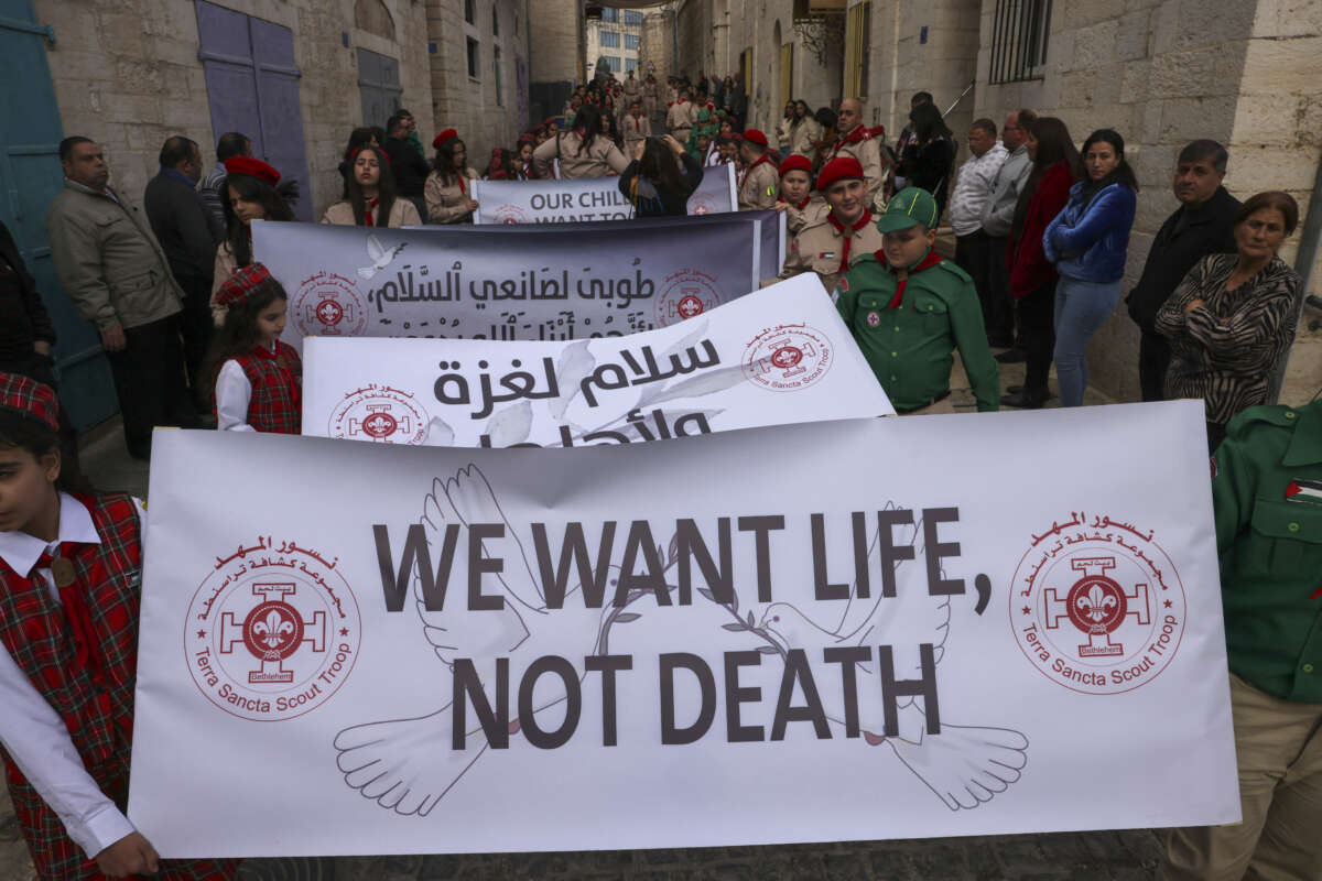 Palestinians partake in the yearly Christmas procession towards the Church of the Nativity in Bethlehem town in the Israel-occupied West Bank on December 24, 2024.