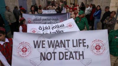 Palestinians partake in the yearly Christmas procession towards the Church of the Nativity in Bethlehem town in the Israel-occupied West Bank on December 24, 2024.