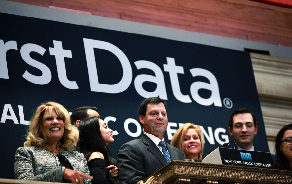 First Data Corporation CEO Frank Bisignano (center) looks around the New York Stock Exchange after ringing the opening bell to celebrate First Data's initial public offering on October 16, 2015, in New York City.