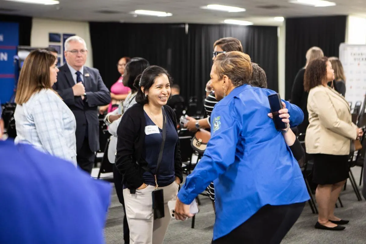 People gather before the ribbon cutting ceremony at the Vicars Community Center in Atlanta, Georgia, in July 2024.