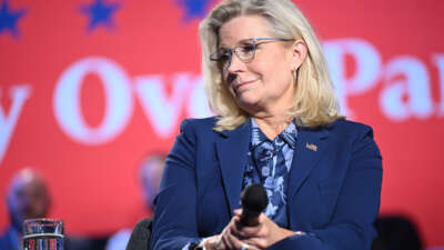 Former Rep. Liz Cheney looks on during a moderated conversation with Vice President and Democratic presidential candidate Kamala Harris at the Royal Oak Music Theatre in Royal Oak, Michigan, on October 21, 2024.