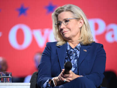 Former Rep. Liz Cheney looks on during a moderated conversation with Vice President and Democratic presidential candidate Kamala Harris at the Royal Oak Music Theatre in Royal Oak, Michigan, on October 21, 2024.