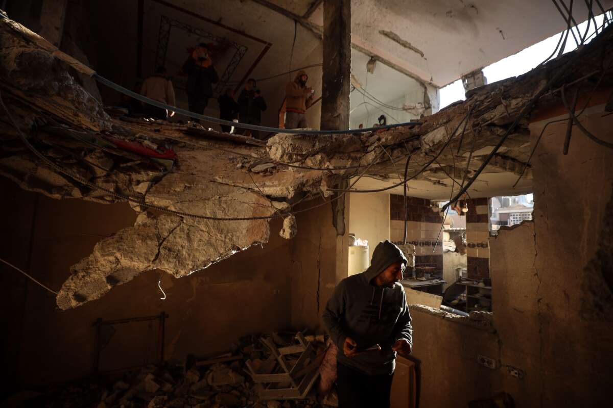 People search the rubble of a building destroyed in an Israeli strike in Deir el-Balah in the central Gaza Strip on January 9, 2025.