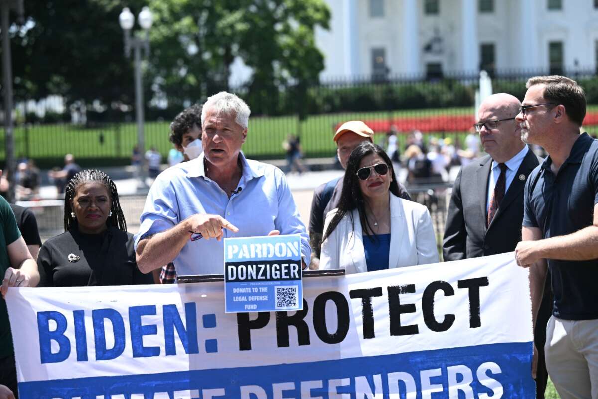 Environmental human rights lawyer Steven Donziger (C) and climate activists, including Rep. Cori Bush and Rep. Rashida Tlaib rally to demand a pardon for Donziger who was involved in legal action against oil giant Chevron, at Lafayette Square in front of the White House in Washington, D.C., on June 12, 2024.