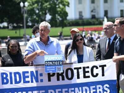 Environmental human rights lawyer Steven Donziger (C) and climate activists, including Rep. Cori Bush and Rep. Rashida Tlaib rally to demand a pardon for Donziger who was involved in legal action against oil giant Chevron, at Lafayette Square in front of the White House in Washington, D.C., on June 12, 2024.