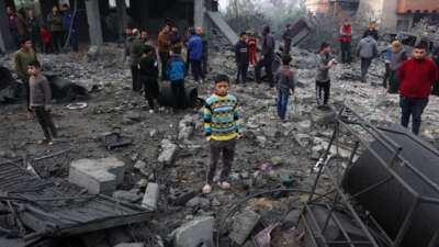 People check the rubble of buildings hit in Israeli strikes the previous night in Jabalia in the northern Gaza Strip, on January 16, 2025, following a truce announcement amid the war between Israel and the Palestinian Hamas movement.