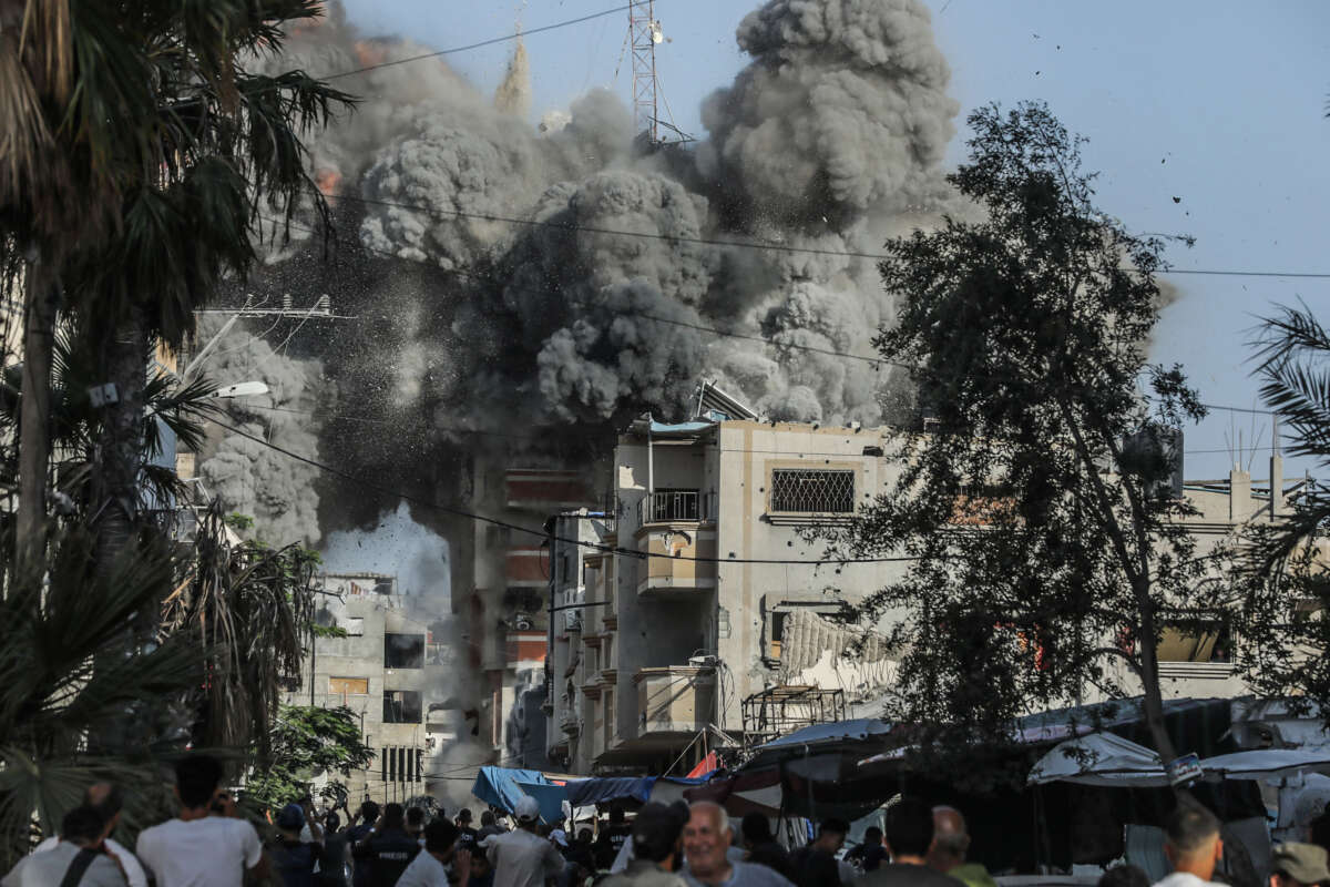 Thick smoke billows from a residential building in Bureij refugee camp after it was hit by an Israeli airstrike, in Deir al-Balah, Palestinian Territories, on June 3, 2024.