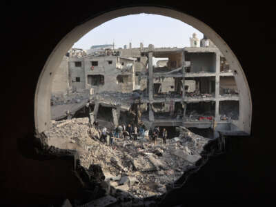 Palestinians inspect the damage in Gaza City's al-Zaitoun neighborhood on December 26, 2024.