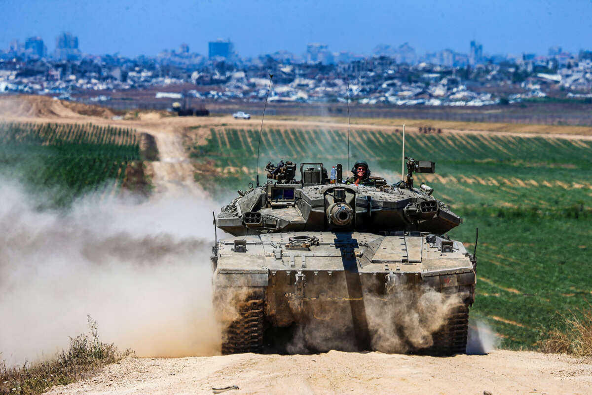 An Israeli army battle tank moves near the border with the Gaza Strip in southern Israel on May 16, 2024.