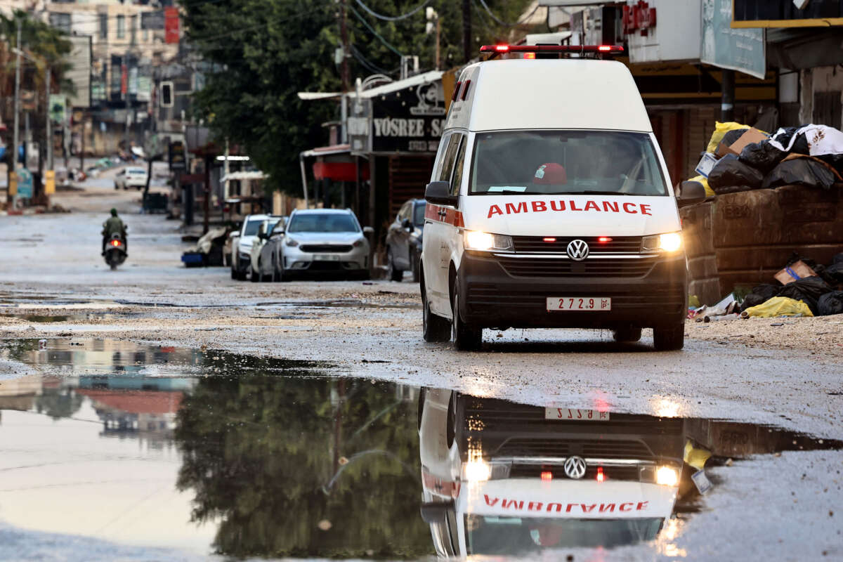 An ambulance drives in the Jenin camp, in the Israeli-occupied West Bank, on November 19, 2024.