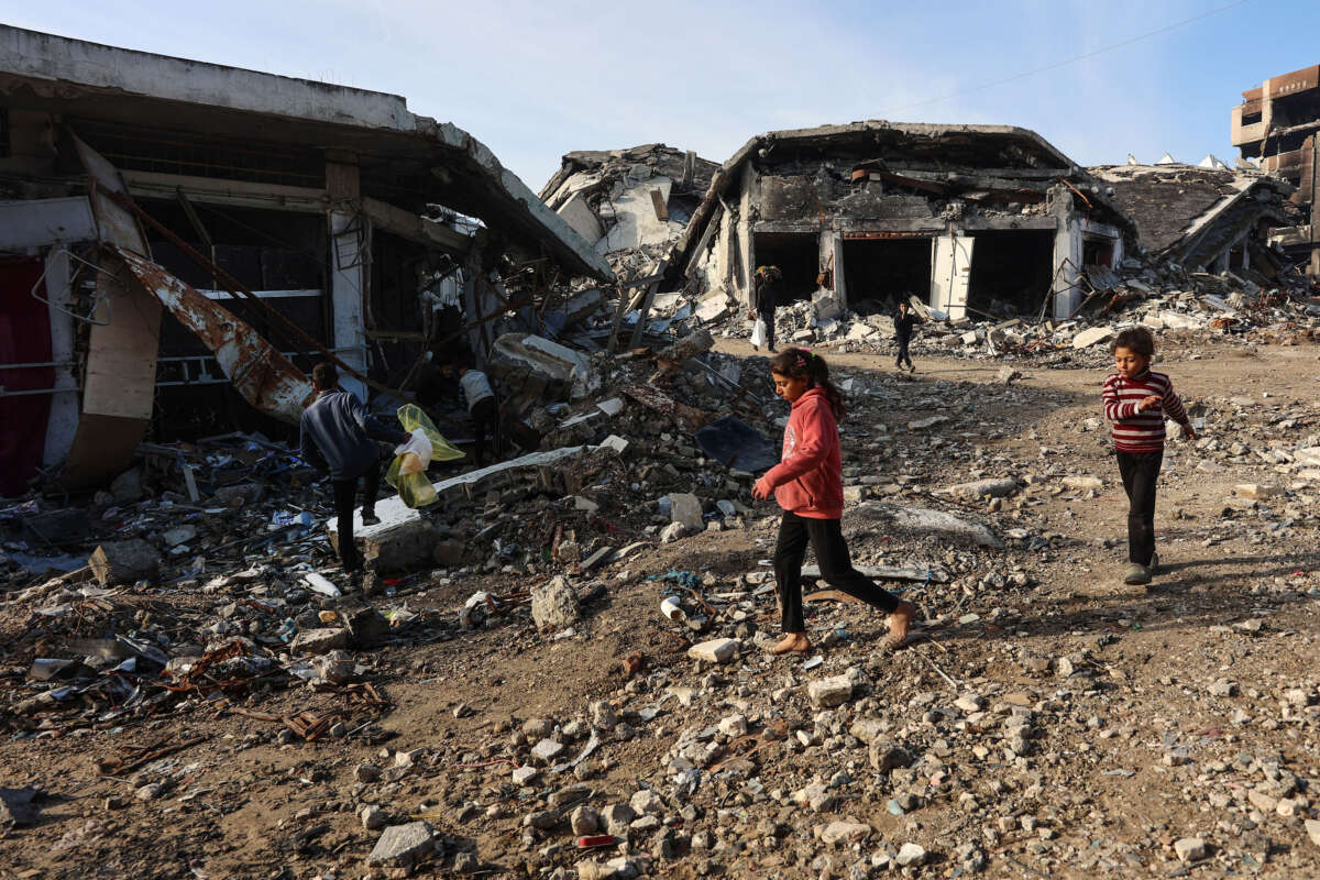 Palestinian children run amid the destruction in the Shujaiya neighbourhood of Gaza City, in the northern Gaza Strip on January 4, 2025.