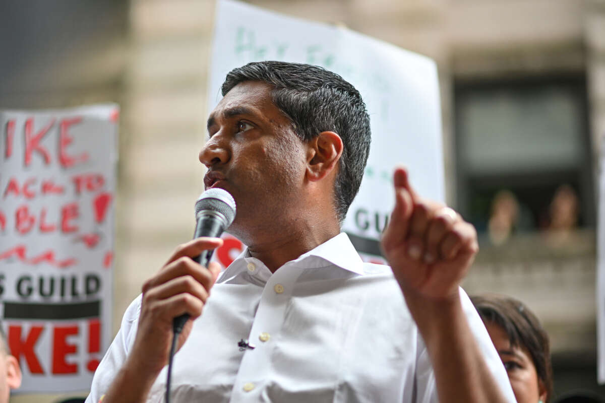 Rep. Ro Khanna speaks to flight attendants, members, and supporters of the WGA and SAG-AFTRA on the picket line outside Netflix and Warner Bros. on August 17, 2023, in New York City.