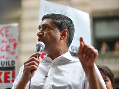 Rep. Ro Khanna speaks to flight attendants, members, and supporters of the WGA and SAG-AFTRA on the picket line outside Netflix and Warner Bros. on August 17, 2023, in New York City.