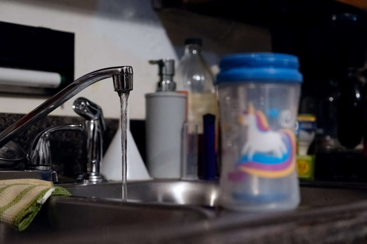 A running kitchen faucet