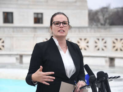 Allison Riggs speaks to the press in front of the U.S. Supreme Court in Washington, D.C., on December 7, 2022.